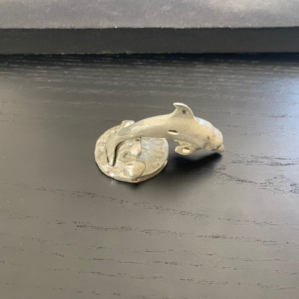 Silver dolphin figurine